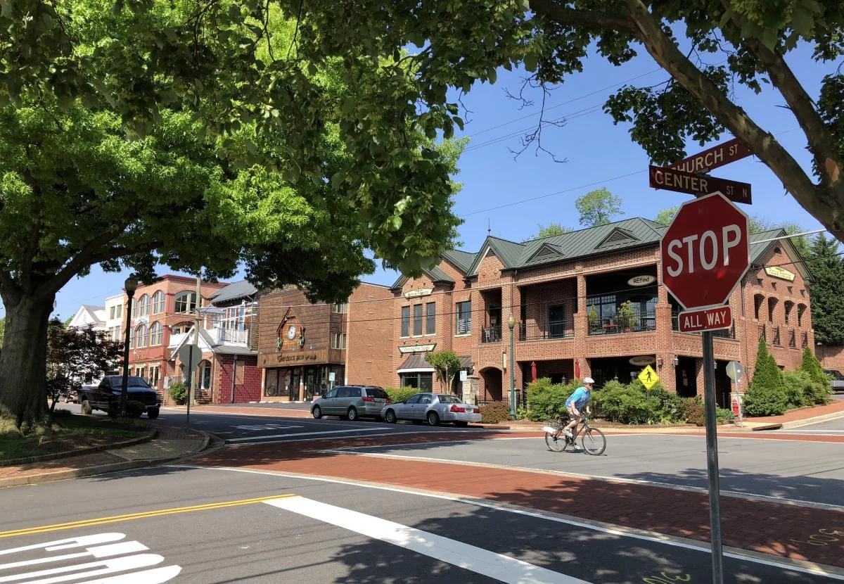 Shops and brick buildings at Church Street and Center Street in Vienna, Virginia.